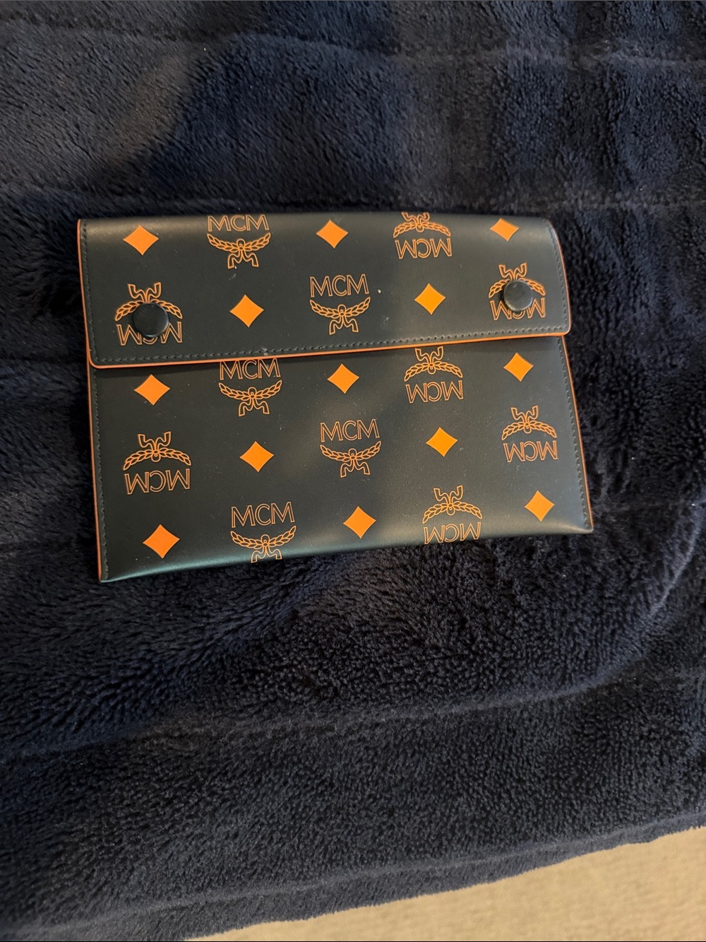 MCM Black Clutch with Orange Logo Motif